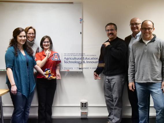 AETI faculty group with department sign
