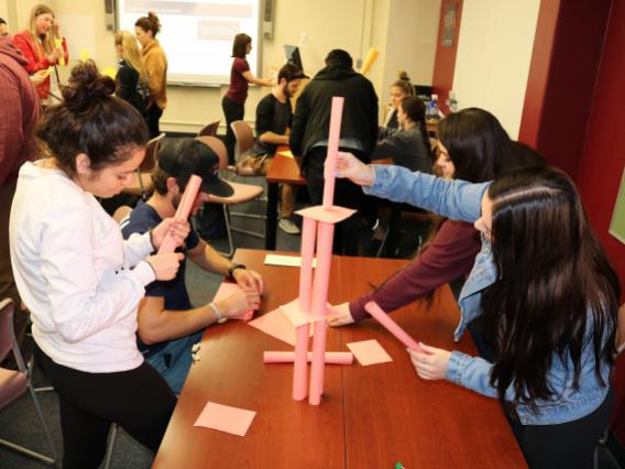 Students participating in team building activity in ALC 409