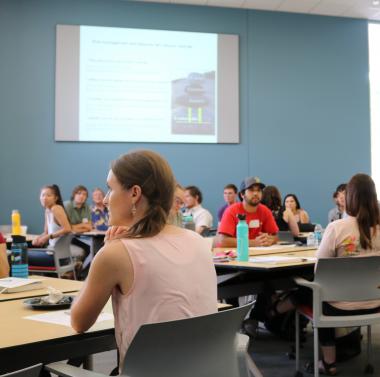 Students in a classroom at a CALS training. 